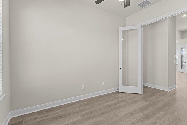 unfurnished bedroom featuring ceiling fan, a closet, and light hardwood / wood-style flooring