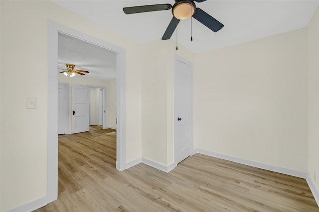 unfurnished room featuring ceiling fan and light hardwood / wood-style flooring