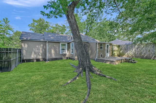 back of house featuring a yard