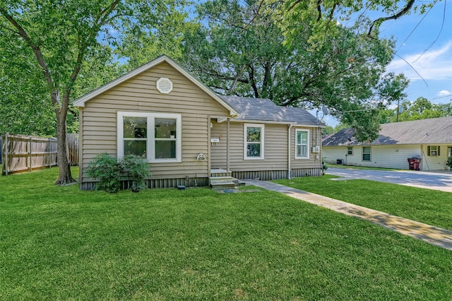 view of front of property with a front yard and a patio