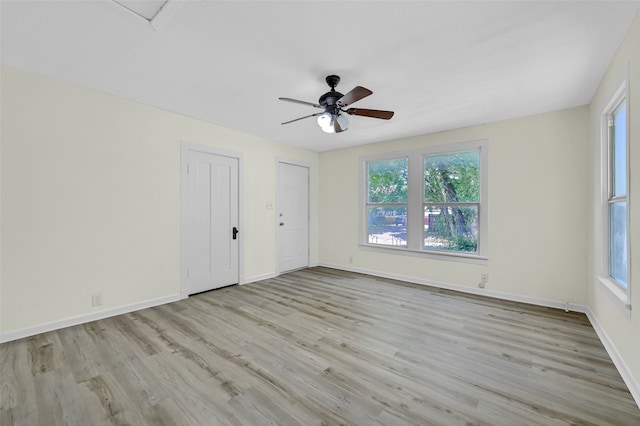 unfurnished room with ceiling fan and light wood-type flooring