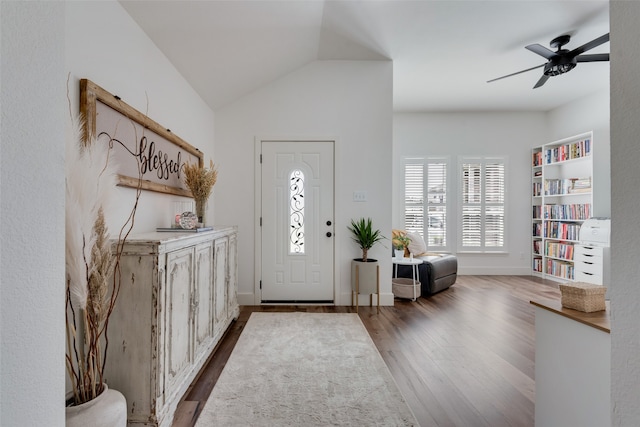 entrance foyer featuring ceiling fan, vaulted ceiling, and wood-type flooring