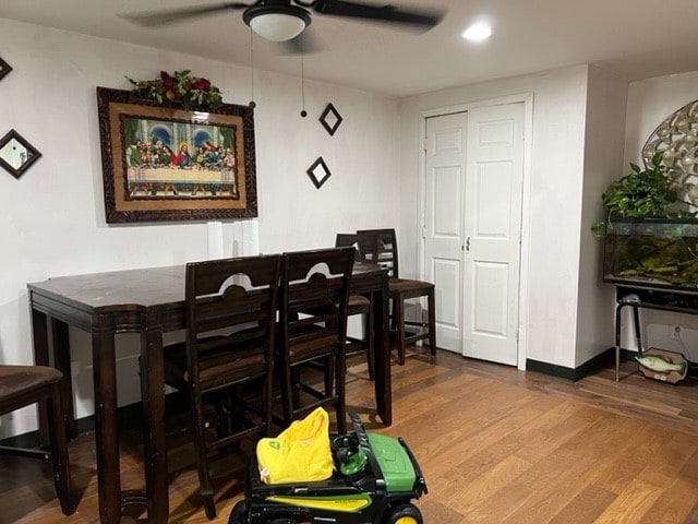 dining space featuring hardwood / wood-style flooring and ceiling fan