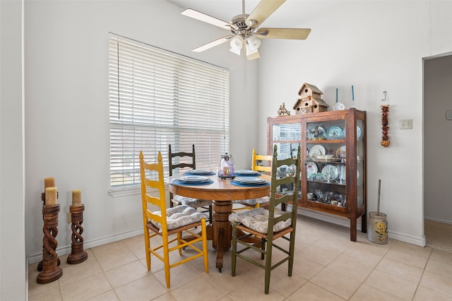 dining room with ceiling fan and light tile patterned floors