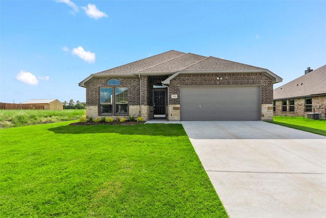 view of front of home with a garage and a front yard