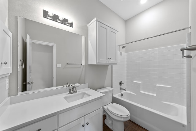 full bathroom featuring shower / bathtub combination, vanity, hardwood / wood-style floors, and toilet