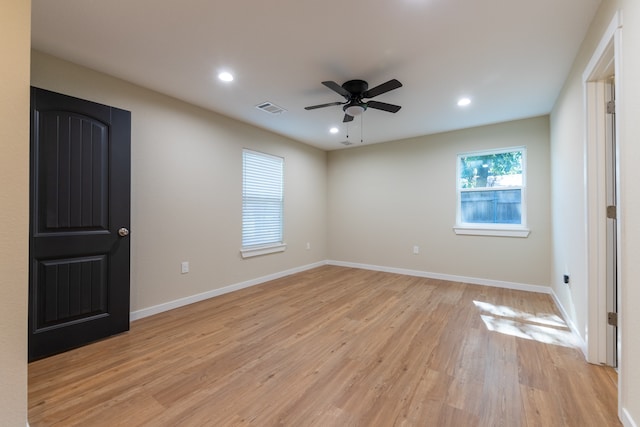 unfurnished room featuring light hardwood / wood-style floors and ceiling fan