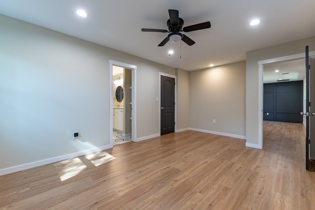 spare room with ceiling fan and light hardwood / wood-style flooring