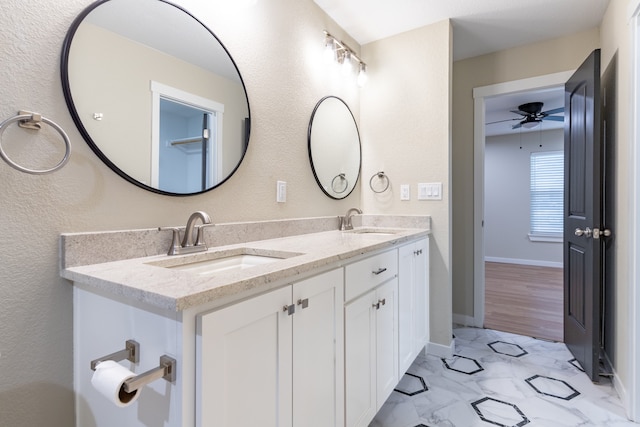 bathroom with vanity, hardwood / wood-style flooring, and ceiling fan