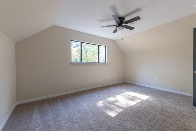 bonus room with lofted ceiling, carpet flooring, and ceiling fan