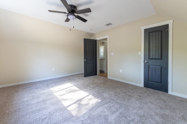 unfurnished bedroom featuring light carpet and ceiling fan