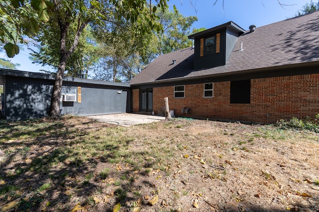 rear view of house with a patio