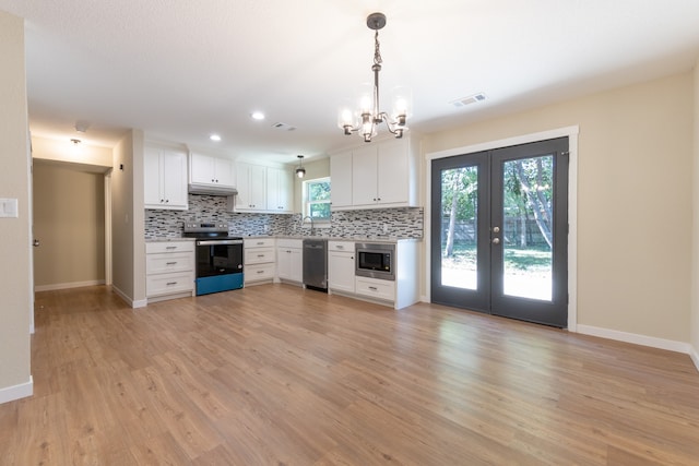 kitchen with white cabinetry, stainless steel appliances, light wood-type flooring, and pendant lighting