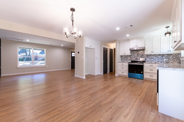 kitchen featuring backsplash, decorative light fixtures, stainless steel range with electric cooktop, light wood-type flooring, and white cabinetry