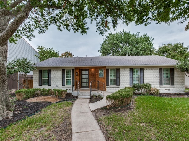 ranch-style home with a front yard