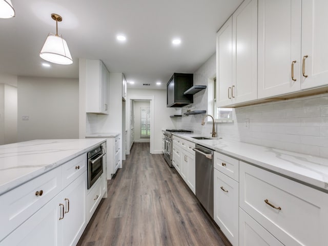 kitchen featuring white cabinetry, appliances with stainless steel finishes, dark hardwood / wood-style flooring, and sink