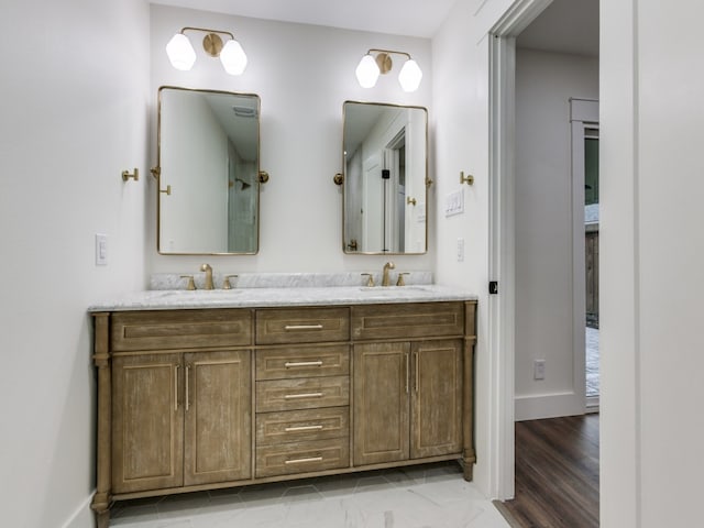 bathroom with hardwood / wood-style floors and vanity