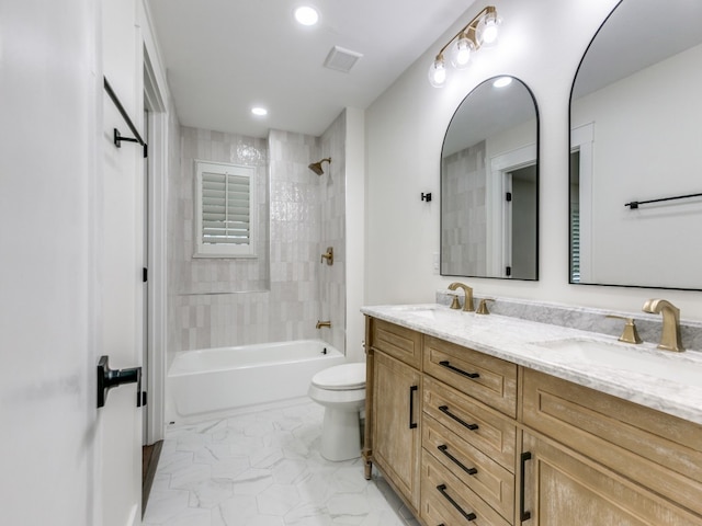 full bathroom with toilet, tiled shower / bath combo, and vanity