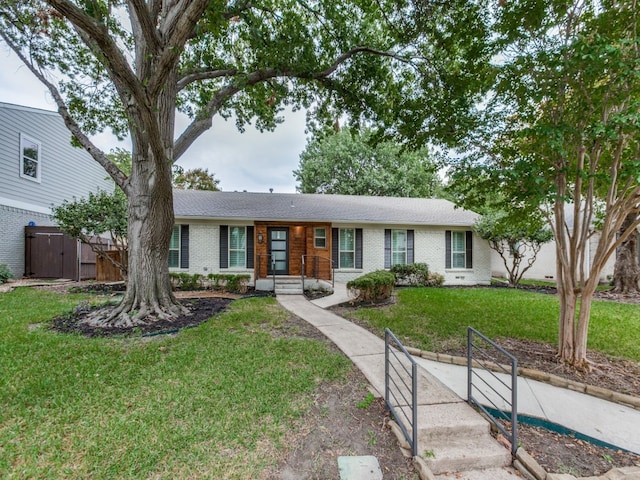 ranch-style home with a front yard