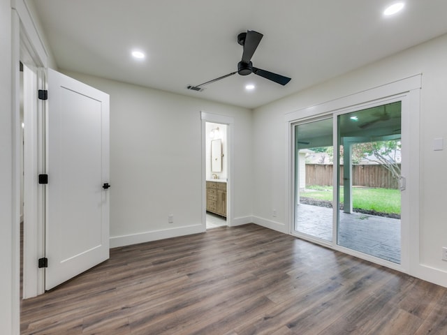 unfurnished room with dark wood-type flooring and ceiling fan