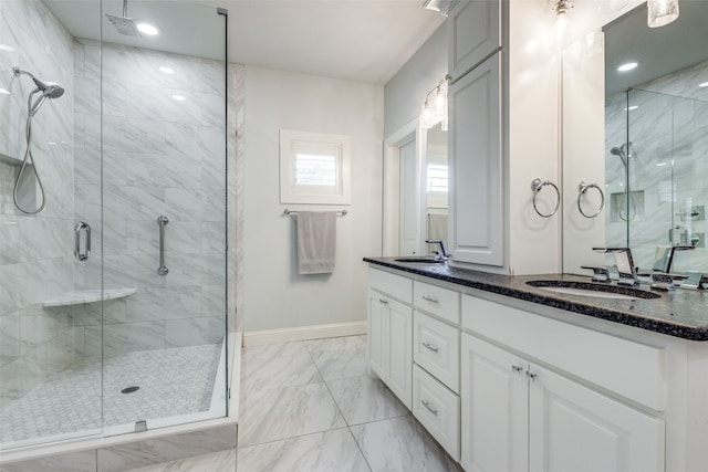 bathroom featuring dual vanity, tile patterned floors, and a shower with shower door