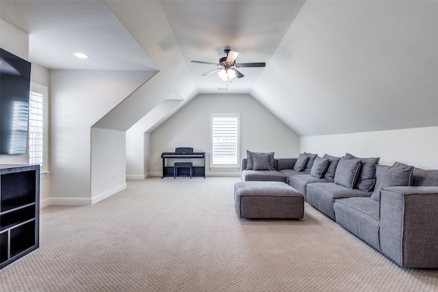 living room featuring lofted ceiling, carpet flooring, and ceiling fan