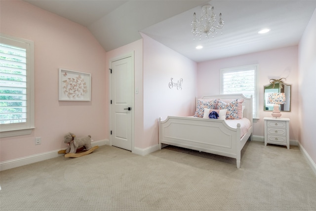 bedroom with light carpet, multiple windows, and a chandelier