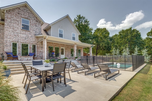 view of patio with a fenced in pool