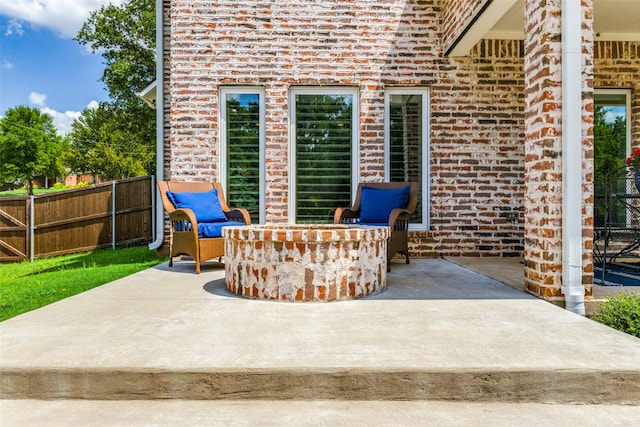 view of patio / terrace with a fire pit