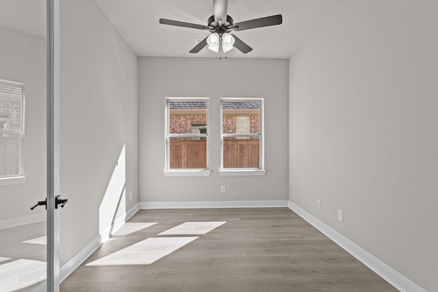 unfurnished room featuring ceiling fan and light hardwood / wood-style floors