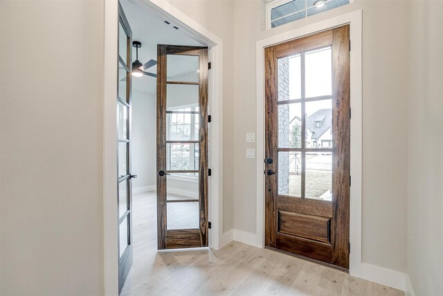 unfurnished bedroom featuring light hardwood / wood-style floors, ceiling fan, and a closet