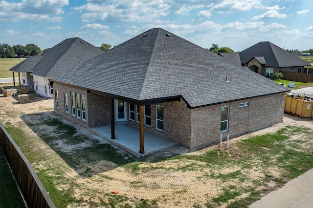 back of house with a patio area