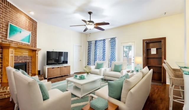 living room featuring a fireplace, dark hardwood / wood-style flooring, and ceiling fan