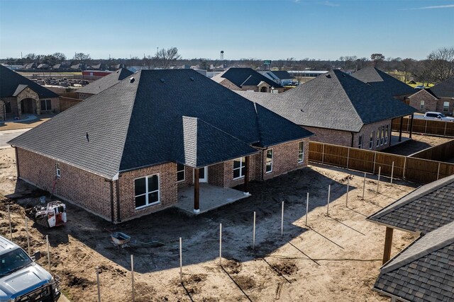 back of property featuring a patio