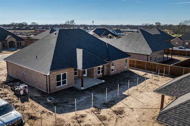 birds eye view of property with a residential view