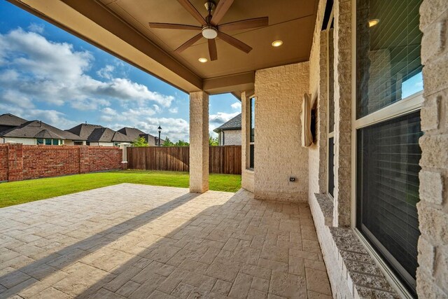 view of patio featuring ceiling fan