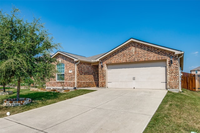 ranch-style house featuring a garage and a front lawn