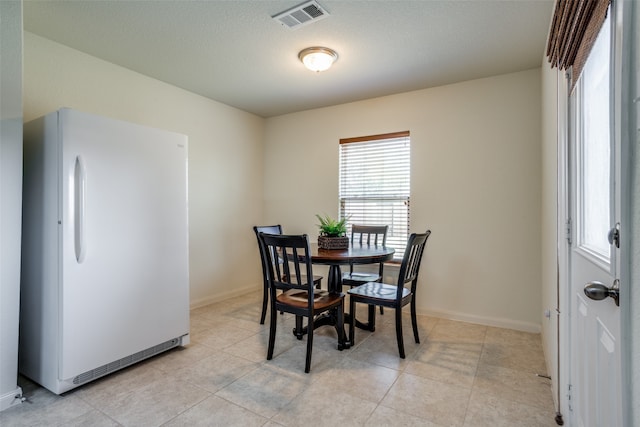 view of tiled dining room