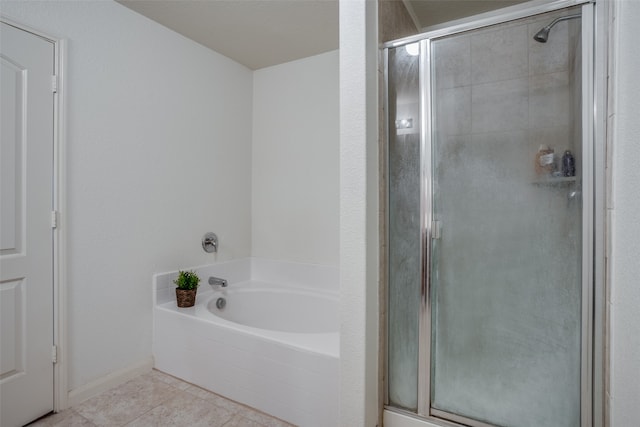 bathroom featuring shower with separate bathtub and tile patterned floors