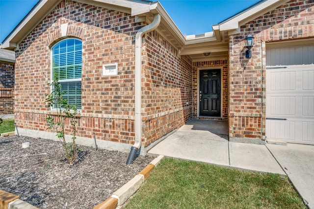 311 Soap Tree Dr, Princeton, TX 75407 - property entrance with brick siding and a garage