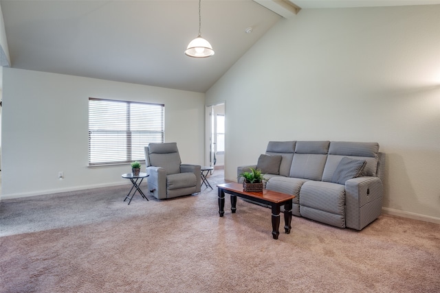 carpeted living room with high vaulted ceiling and beam ceiling