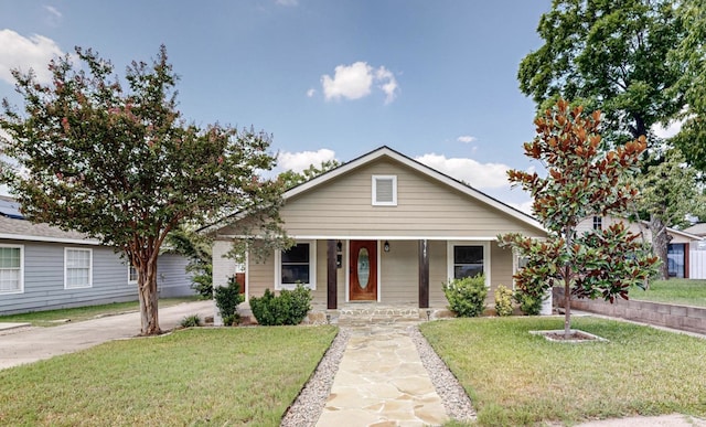 view of front of house with a front lawn and covered porch