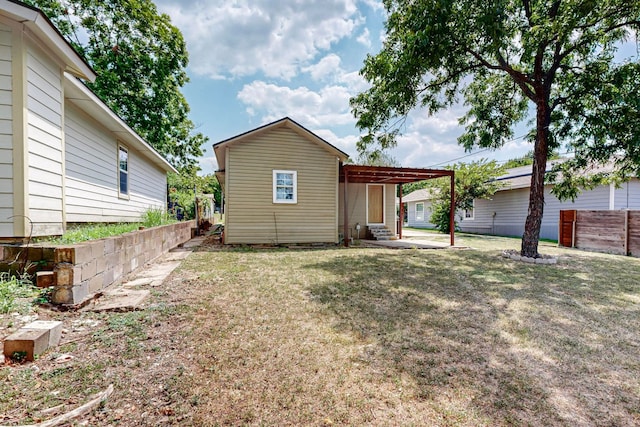 view of front of property with a patio and a front lawn