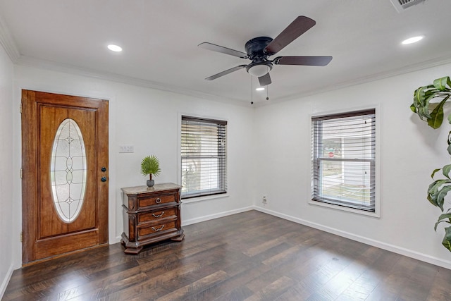 foyer with ceiling fan, dark hardwood / wood-style floors, and ornamental molding