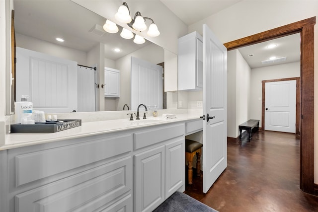 bathroom featuring vanity and concrete floors