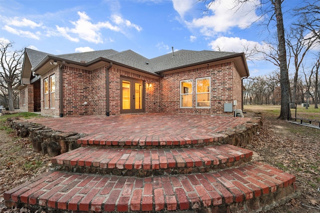 back of property with french doors and a patio