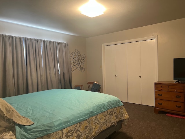 carpeted bedroom with a closet