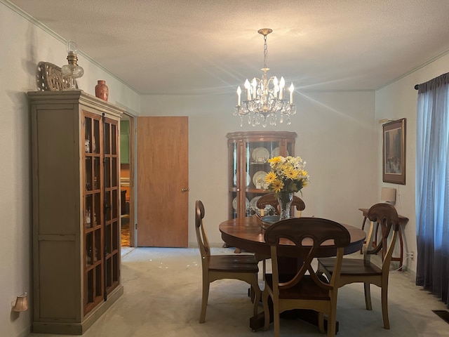 carpeted dining area featuring an inviting chandelier and a textured ceiling