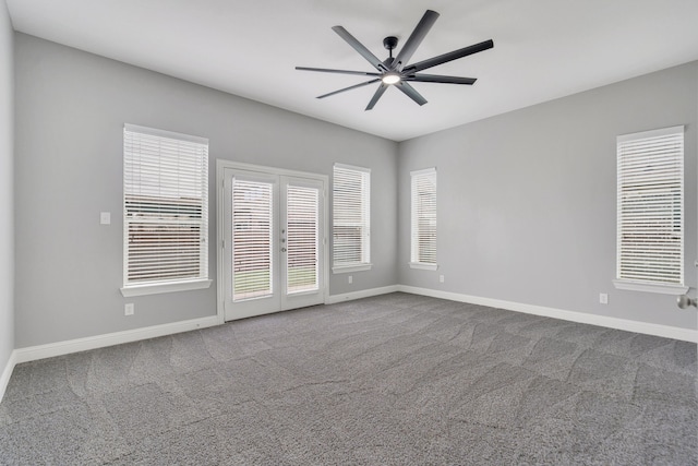 spare room with carpet floors, ceiling fan, and french doors