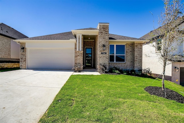 view of front of property with a front yard and a garage